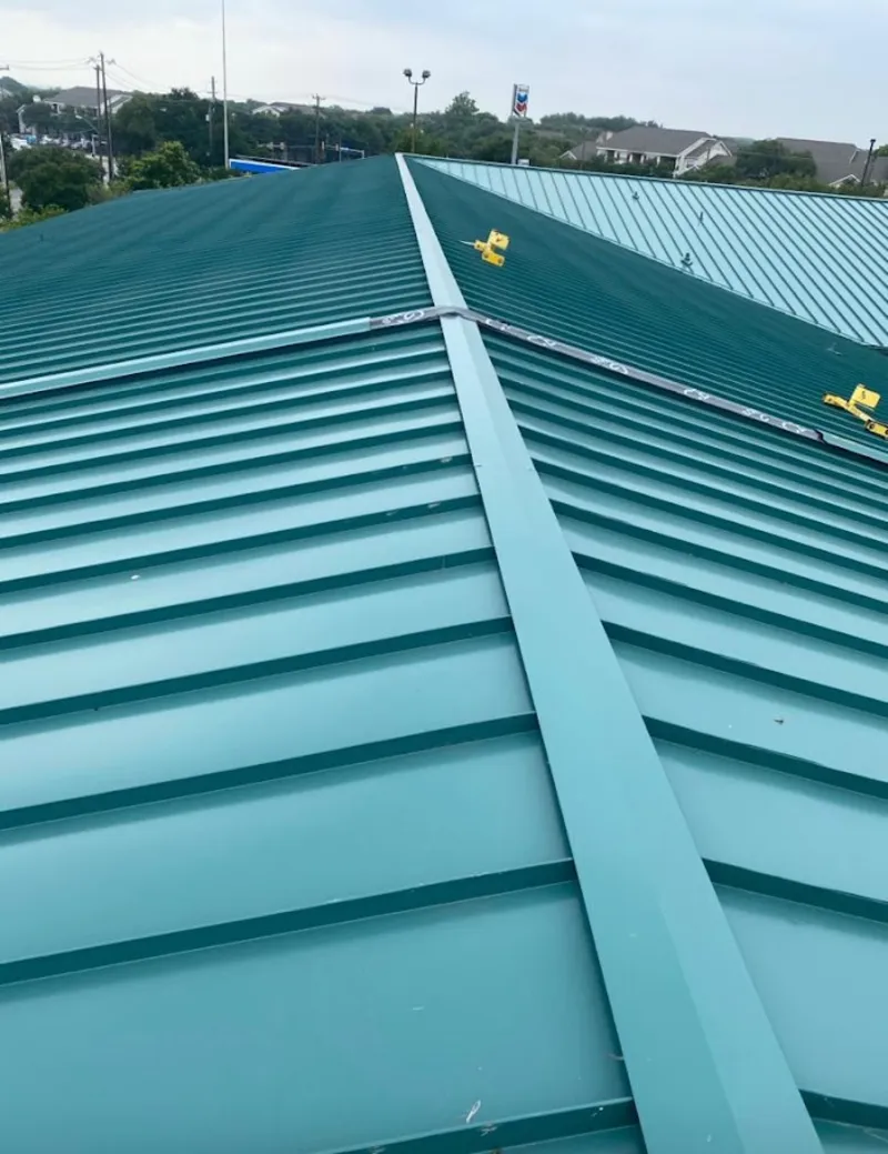 Green commercial metal roof ridge and valley for Metal Roof Repair in Pleasant Valley